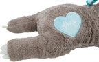 Detail van het blauwe hartje met hartslaglijn in de puppy knuffel